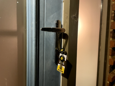 A person using the right key to unlock a door