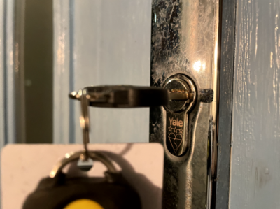 An image showing a lock with a key inserted and turned, demonstrating key spinning in lock issue.